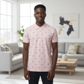 Young Nigerian male model wearing blush pink all-over crest print polo shirt, front view
