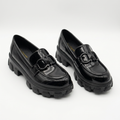 Complete pair of black glossy interlocking-detail chunky loafers on a white background