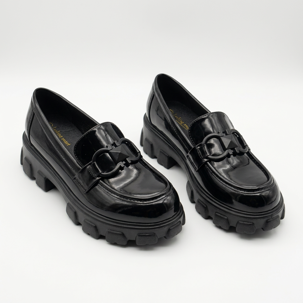 Complete pair of black glossy interlocking-detail chunky loafers on a white background