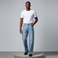 Nigerian male model wearing light blue rhinestone embellished wide-leg jeans