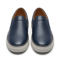 Navy pebbled slip-on shoe pair with contrast stitching and light soles