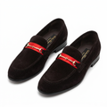 Pair of black men's loafers with red bands and gold-tone bit hardware