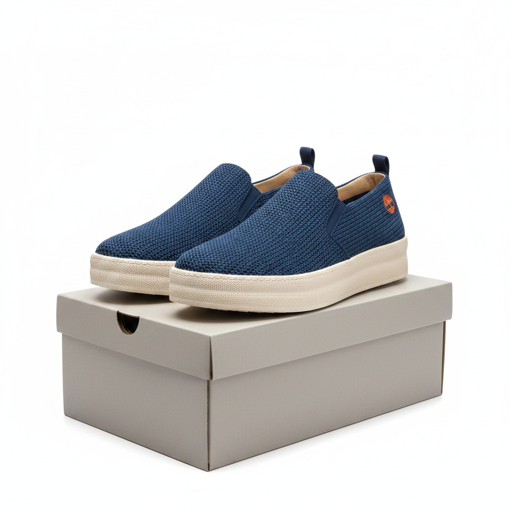 Men's navy blue knit slip-on platform sneakers, complete pair on white background