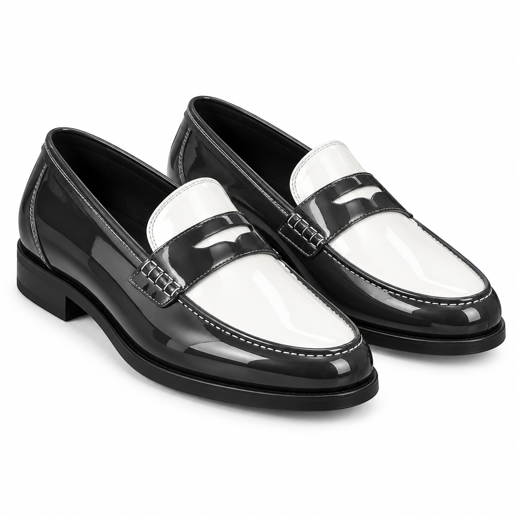 Men's two-tone charcoal and white patent leather penny loafer pair on white background