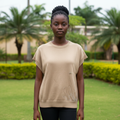 Nigerian teen girl wearing beige rhinestone knit cap-sleeve top