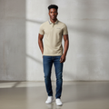 Young Nigerian male model wearing khaki grey tipped slim polo shirt