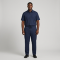 Nigerian man wearing navy button-up shirt and drawstring trouser set