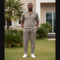 Nigerian male model wearing stone greige matching co-ord set outdoors