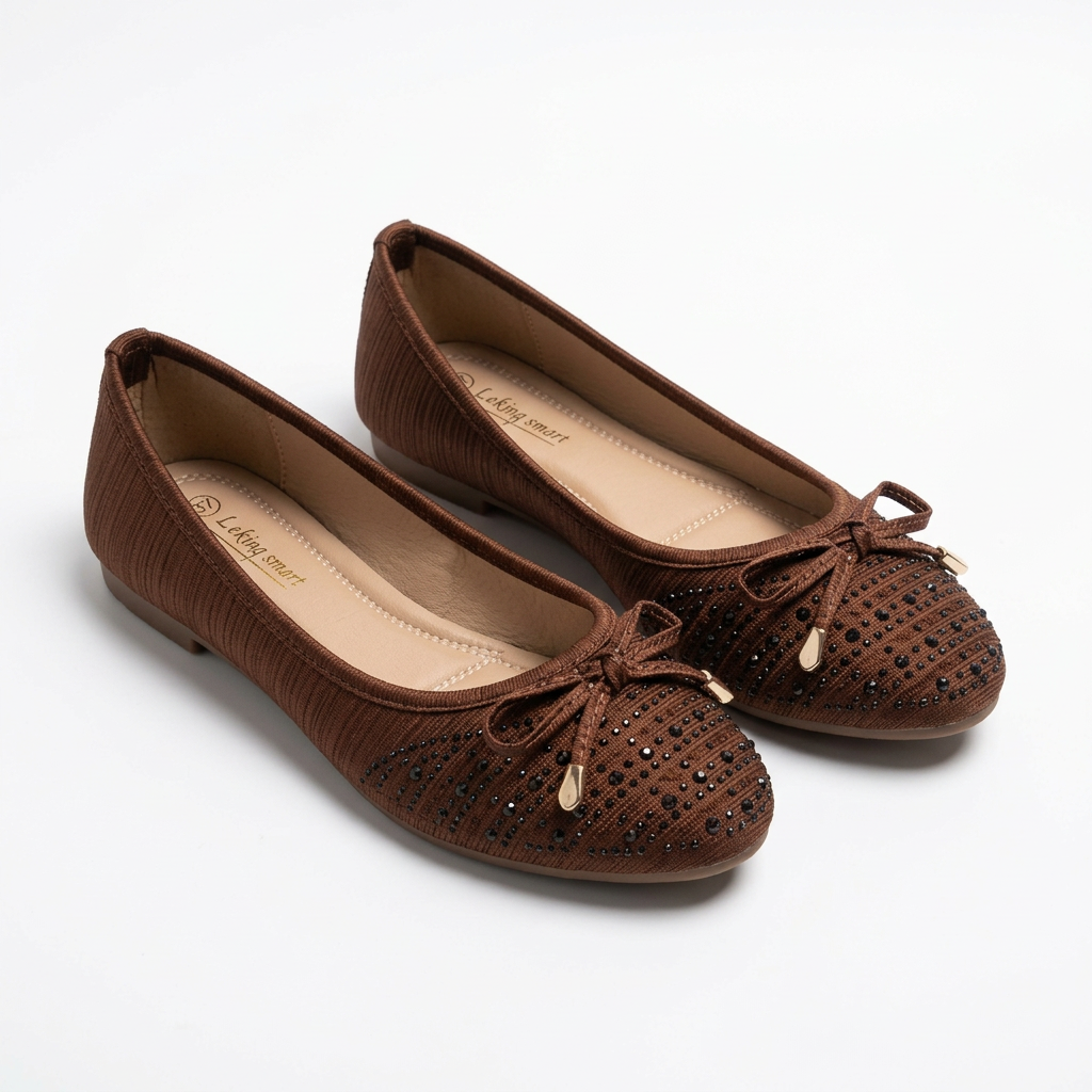 Complete pair of brown textured cord-bow ballet flats resting on a white floor
