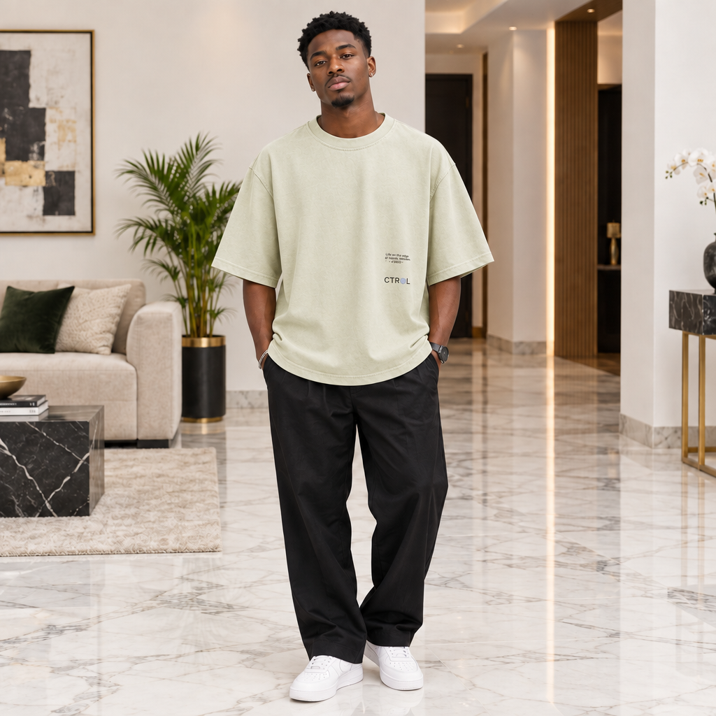 Man wearing sage washed oversized graphic tee