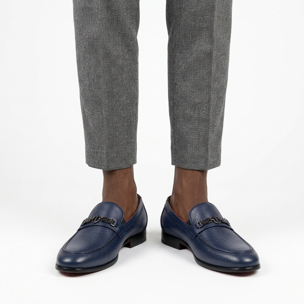 Navy textured geometric-detail loafers properly worn on both feet