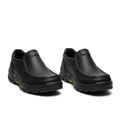 Pair of black apron-toe chunky-sole slip-on shoes on white background