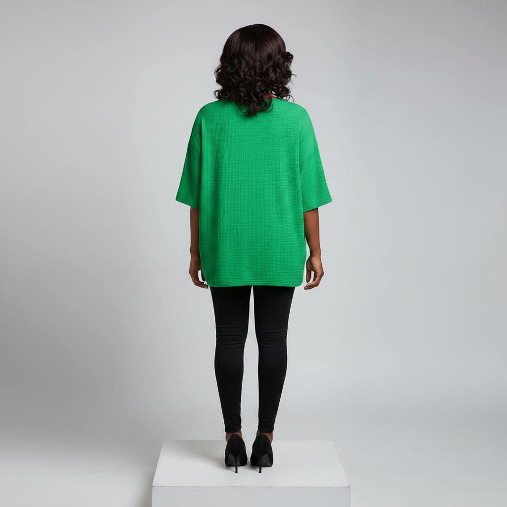 Nigerian female model back view - green rhinestone floral cluster top