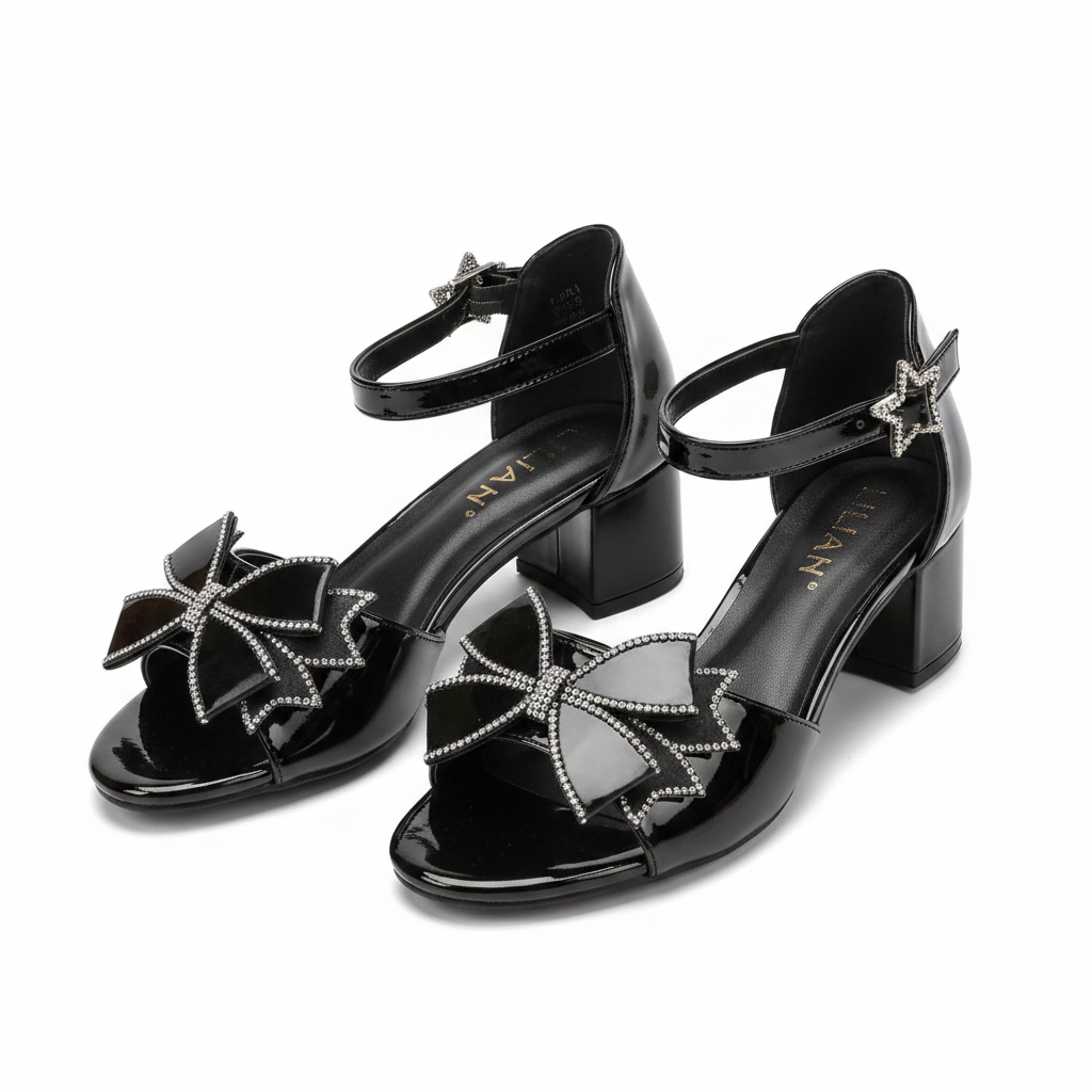 Ghost mannequin pair view of black patent leather block heel sandals with rhinestone bow detail, left and right shoe
