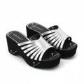 Ghost mannequin pair view of silver metallic fan ray strap chunky platform wedge slide mules