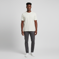 Young Nigerian male wearing cream off-white textured plain crew neck tee