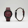 Burgundy dial watch with black case and burgundy leather strap shown from the front and side