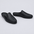 Men's black pebble grain backless mule slippers, front and side view