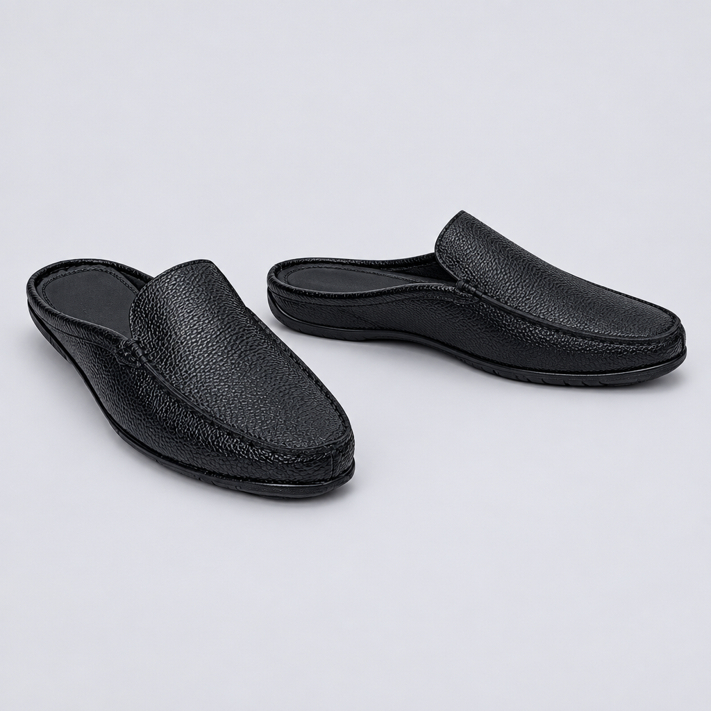 Men's black pebble grain backless mule slippers, front and side view