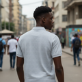 Young Nigerian male model wearing light grey monogram jacquard polo shirt