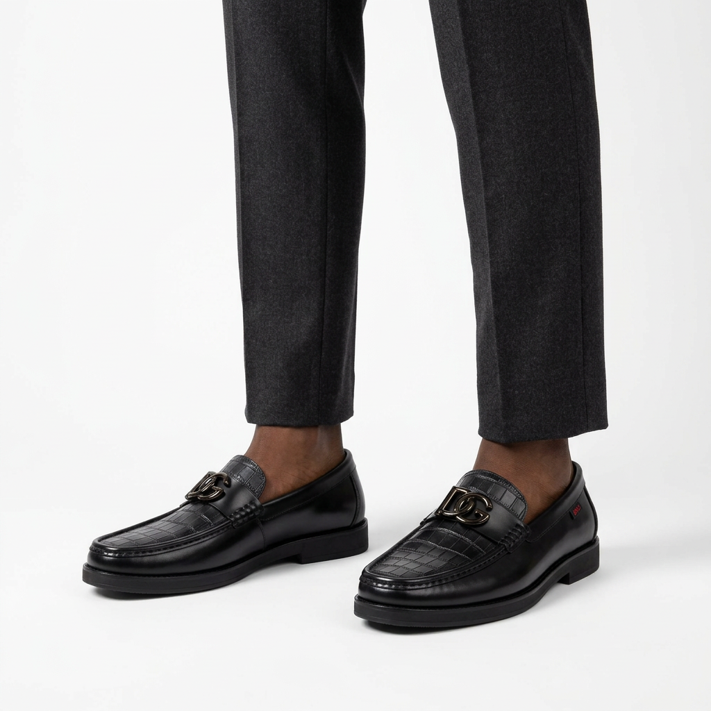 Black croc-panel loafers worn by a male model with both shoes visible