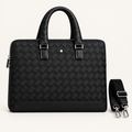 Black basketweave-pattern top-handle bag with detached shoulder strap
