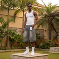 Nigerian male model wearing men's grey washed rhinestone denim shorts streetwear style