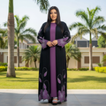 Black abaya set with purple crystal embroidery on Nigerian female model