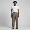 Full-body male model wearing grey waist-strap pleated trousers