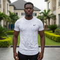 Nigerian male model wearing white grey tonal camo print athletic performance tee