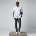 Nigerian male model wearing light blue multi-stripe short-sleeved shirt