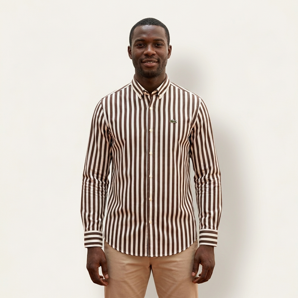Male model wearing a brown and ivory striped long-sleeve shirt against a plain off-white background