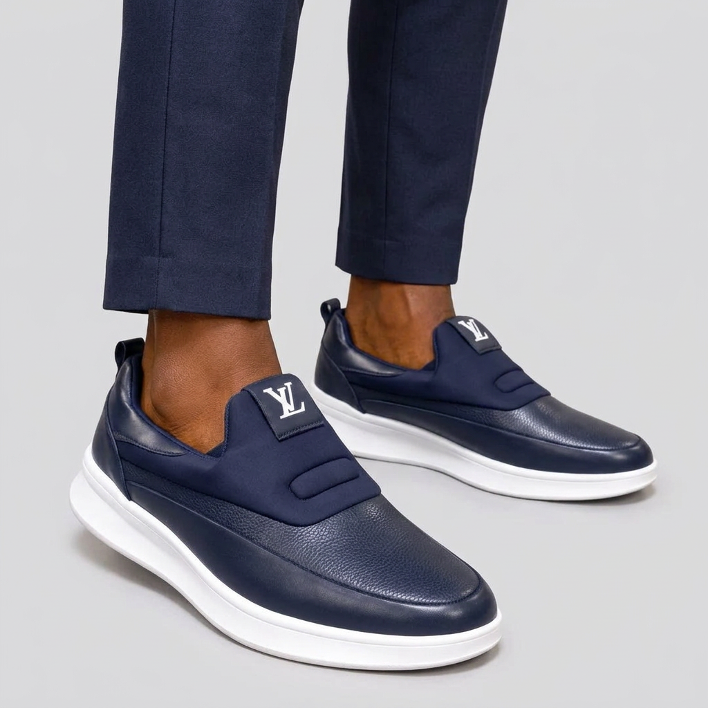 Male model wearing navy textured slip-on shoes with both shoes fully visible