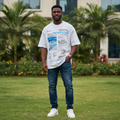 Nigerian male model wearing white editorial all-over print graphic tee – front view