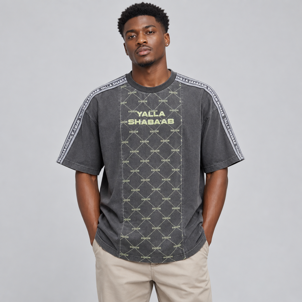 Nigerian man wearing charcoal diamond-panel graphic T-shirt