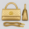 Gold embossed handbag front and side views with matching strap