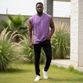 Nigerian male model wearing purple sleeveless vest in outdoor setting