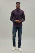 Young Nigerian male wearing burgundy navy plaid slim fit long sleeve shirt