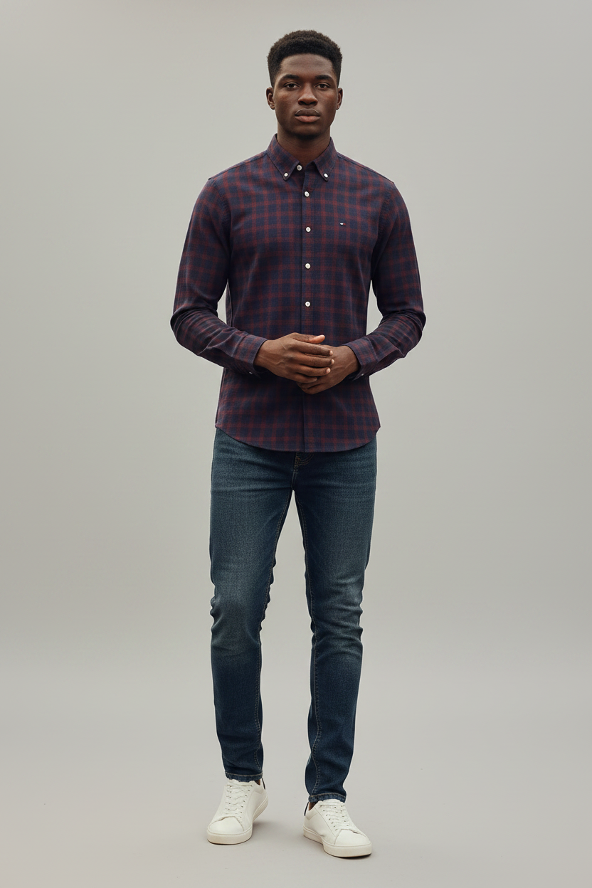 Young Nigerian male wearing burgundy navy plaid slim fit long sleeve shirt
