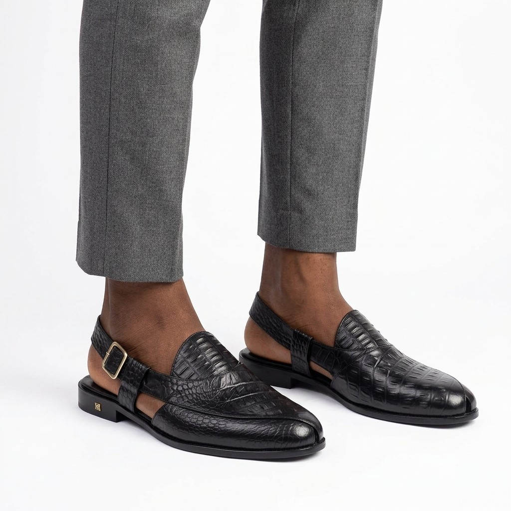 Black crocodile-effect slingback shoes worn on both feet with secured back straps
