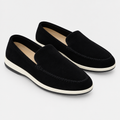 Black slip-on loafer pair on a clean background