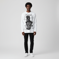 Man wearing the white poster print long sleeve tee
