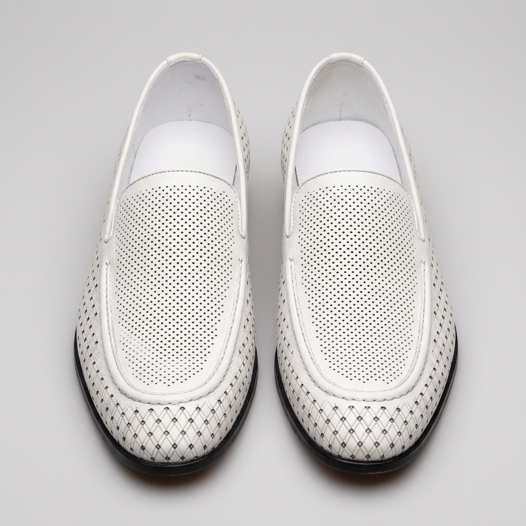 Men's white perforated slip-on loafers, straight-on view of the pair