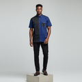 Nigerian male model wearing navy and black colour-block short-sleeved shirt