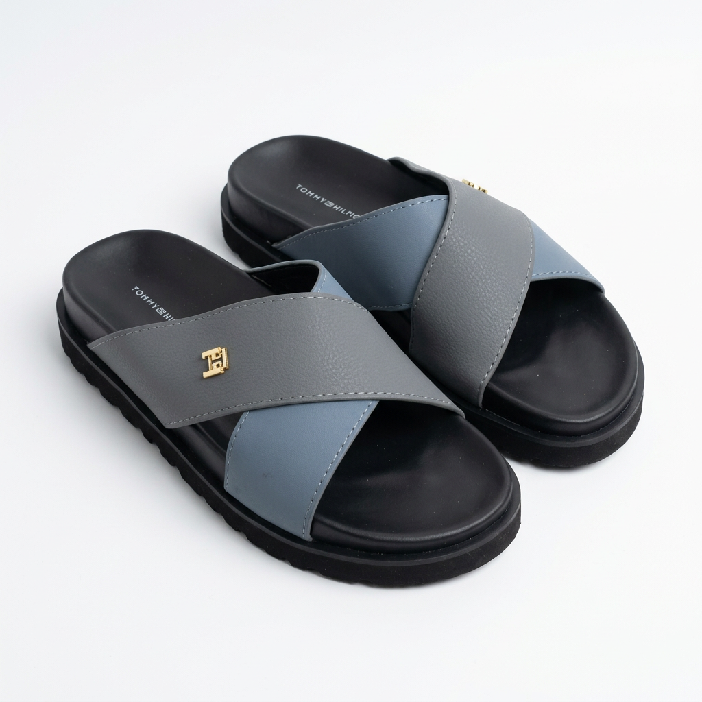 Men’s grey and blue cross-strap slide sandals with gold-tone emblems and black soles