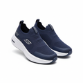 Navy blue knit slip-on sneakers with chunky white sole pair on white background