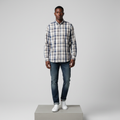 Nigerian male model wearing white navy blue plaid long-sleeved shirt, front view