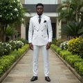 Nigerian male model wearing white double-breasted gold button peak lapel suit