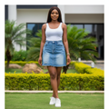 Model shot — Women's Light Blue Denim Mini Skirt with Frayed Hem