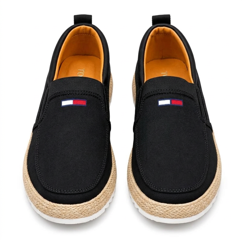 Straight-on black slip-on sneakers with beige woven-look trim and white soles